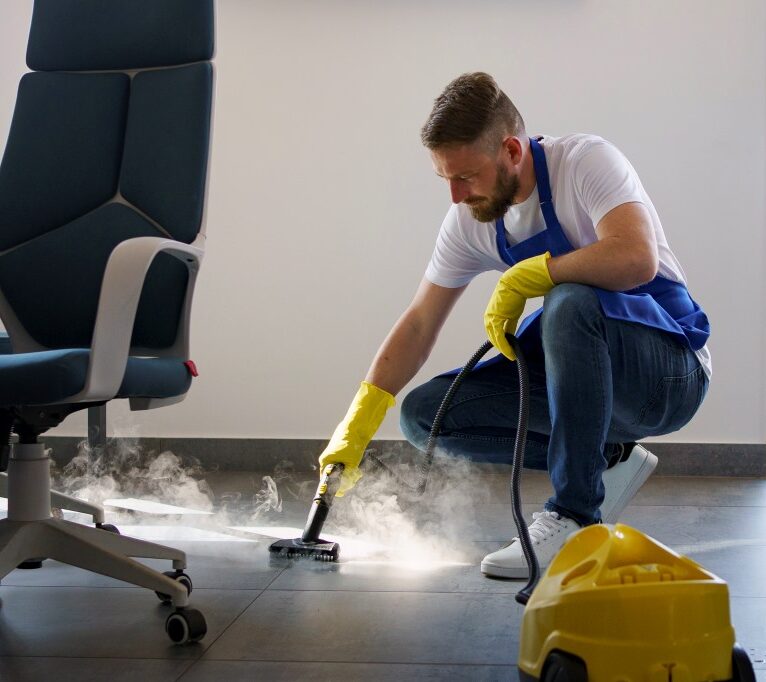 professional-cleaning-service-person-using-steam-cleaner-office